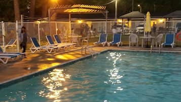 Seasonal outdoor pool, open 9:00 AM to 9 PM, pool loungers