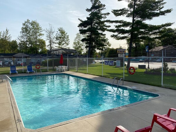 Seasonal outdoor pool, open 9:00 AM to 9 PM, pool loungers