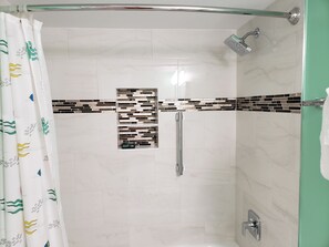 Combined shower/tub, hair dryer, towels, soap