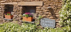 Experience the charm of Cortijo Opazo, a traditional stone building with a warm, welcoming atmosphere.