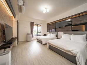 A modern hotel room with two beds, a flat-screen TV, a small desk, and a window with curtains. - Jophina B&B (Donggang)