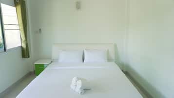 Family Quadruple Room, 1 King Bed, Patio | In-room safe, blackout drapes, soundproofing, free WiFi