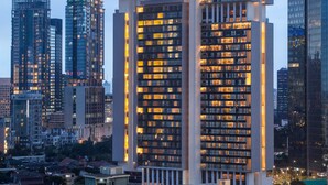 A high-rise building with the name "ASCOTT" prominently displayed on its facade. - Ascott Sudirman Jakarta (Jakarta)