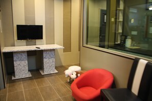 Family Studio Suite | Living area | LCD TV