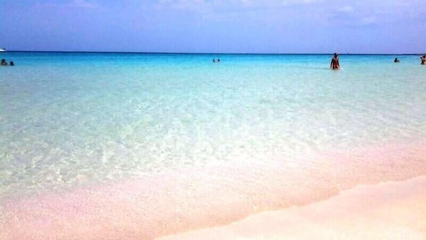A beach with clear turquoise water and a sandy shore. - Hotel Ristorante Mediterraneo Faro (San Vito Lo Capo)