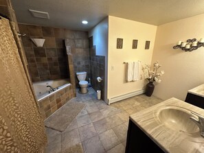 Shower, jetted bath, towels, soap