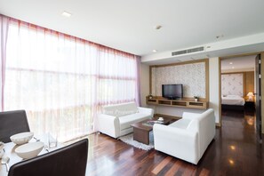 Two Bedrooms Apartment | Living room | 32-inch flat-screen TV with cable channels, TV