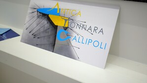 A framed artwork with the text "ANTICA TONNARA GALLIPOLI" on a white background.