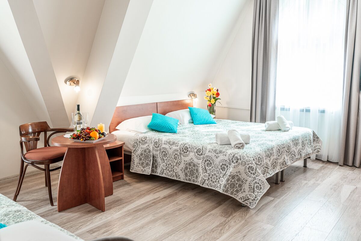 triple room | minibar, in-room safe, desk, blackout curtains