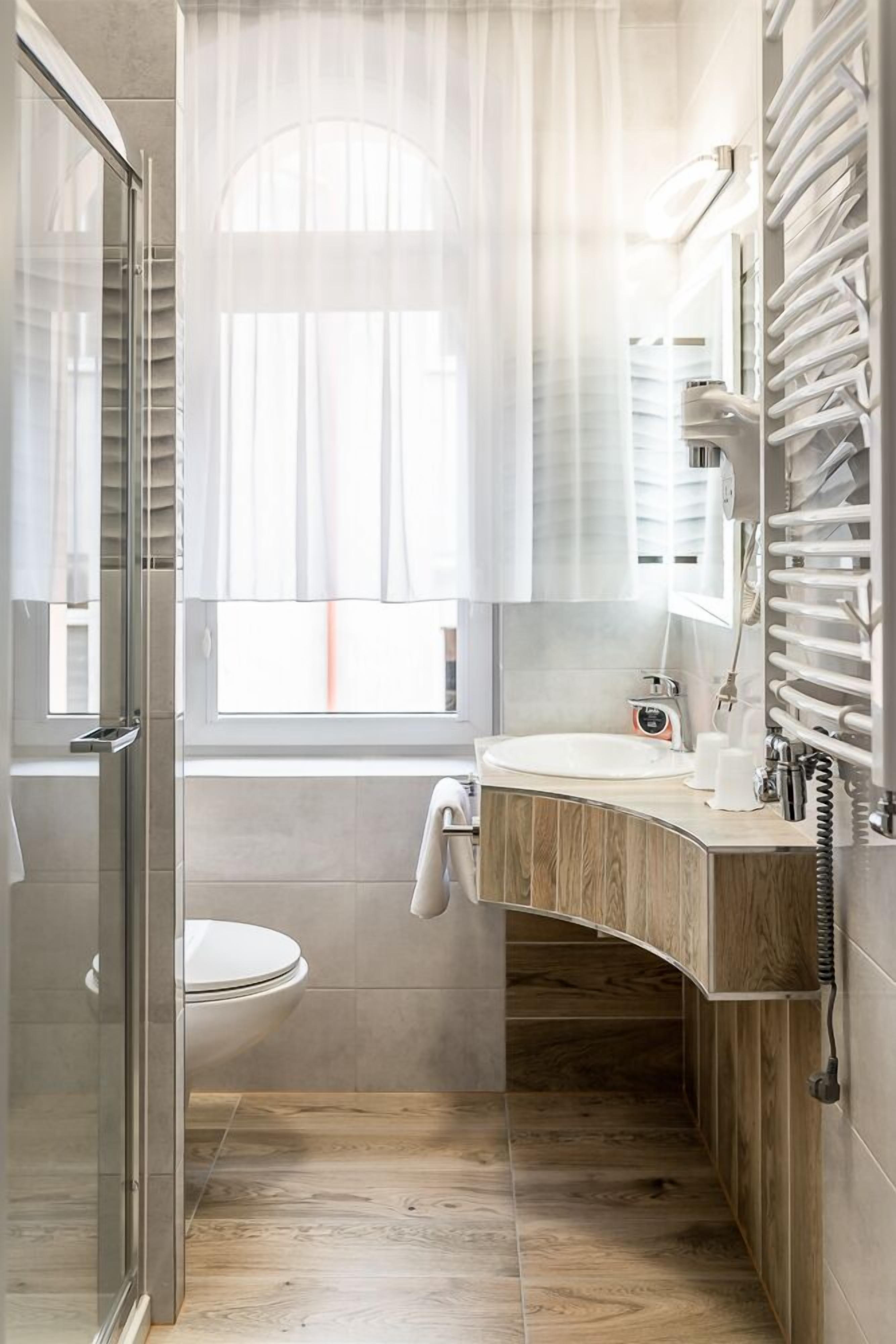 classic double or twin room | bathroom | shower, eco-friendly toiletries, hair dryer, towels