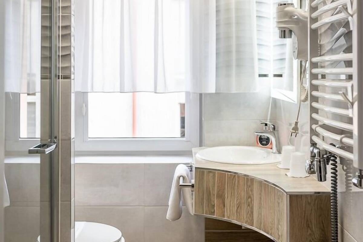 classic double or twin room | bathroom | shower, eco-friendly toiletries, hair dryer, towels