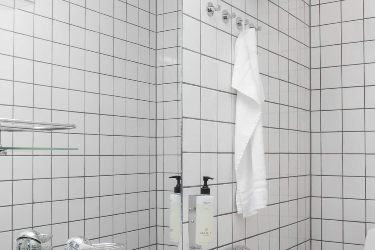 grand studio, 2 bedrooms, lake view (split level with stairs) | bathroom | shower, heated floors, towels