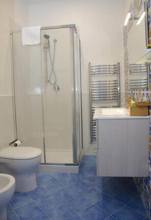 Shower, deep-soaking bathtub, free toiletries, hair dryer