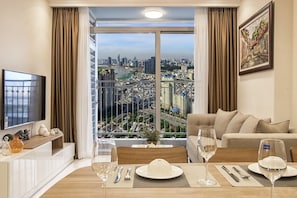 Premium Apartment, 2 Bedrooms, City View | Living area | 43-inch flat-screen TV with cable channels, TV - Brilliant HCMC Service Apartments (Ho Chi Minh City)