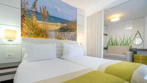 A hotel room with two beds, a large beach mural, a mirror, and a plant. - Mera Brise (Mangalia)