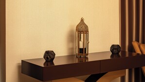 A reception desk with a sign reading "THE SPA BY PALMEIRAS" and a decorative lamp.