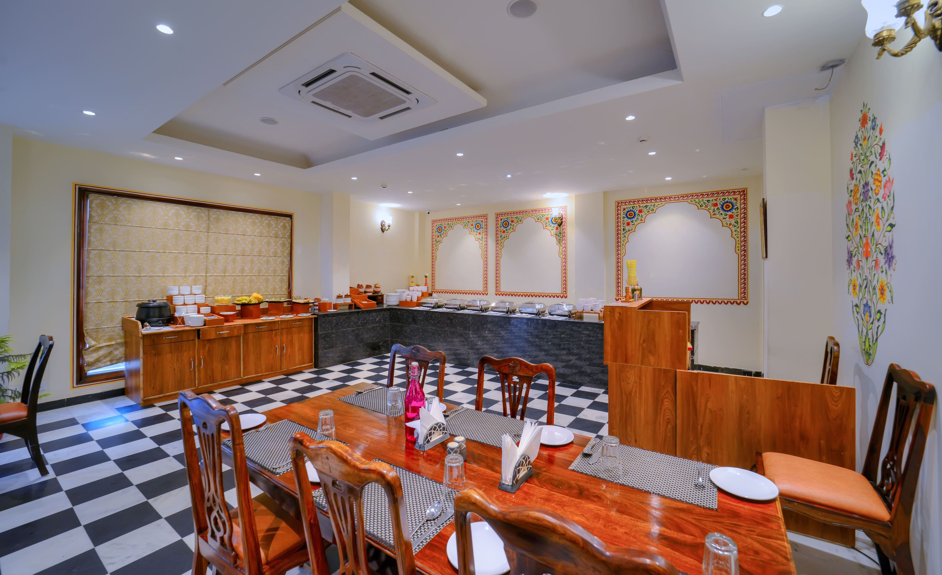 Un restaurant avec un sol à carreaux, des meubles en bois et un comptoir de buffet.