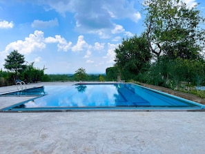 Outdoor pool, pool loungers - WelcomHeritage Mount Valley Resort, Ranthambore (Sawai Madhopur)