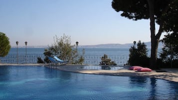 Seasonal outdoor pool, pool loungers