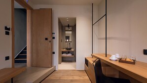 A modern kitchen with wooden countertops, a built-in oven, and a sink.