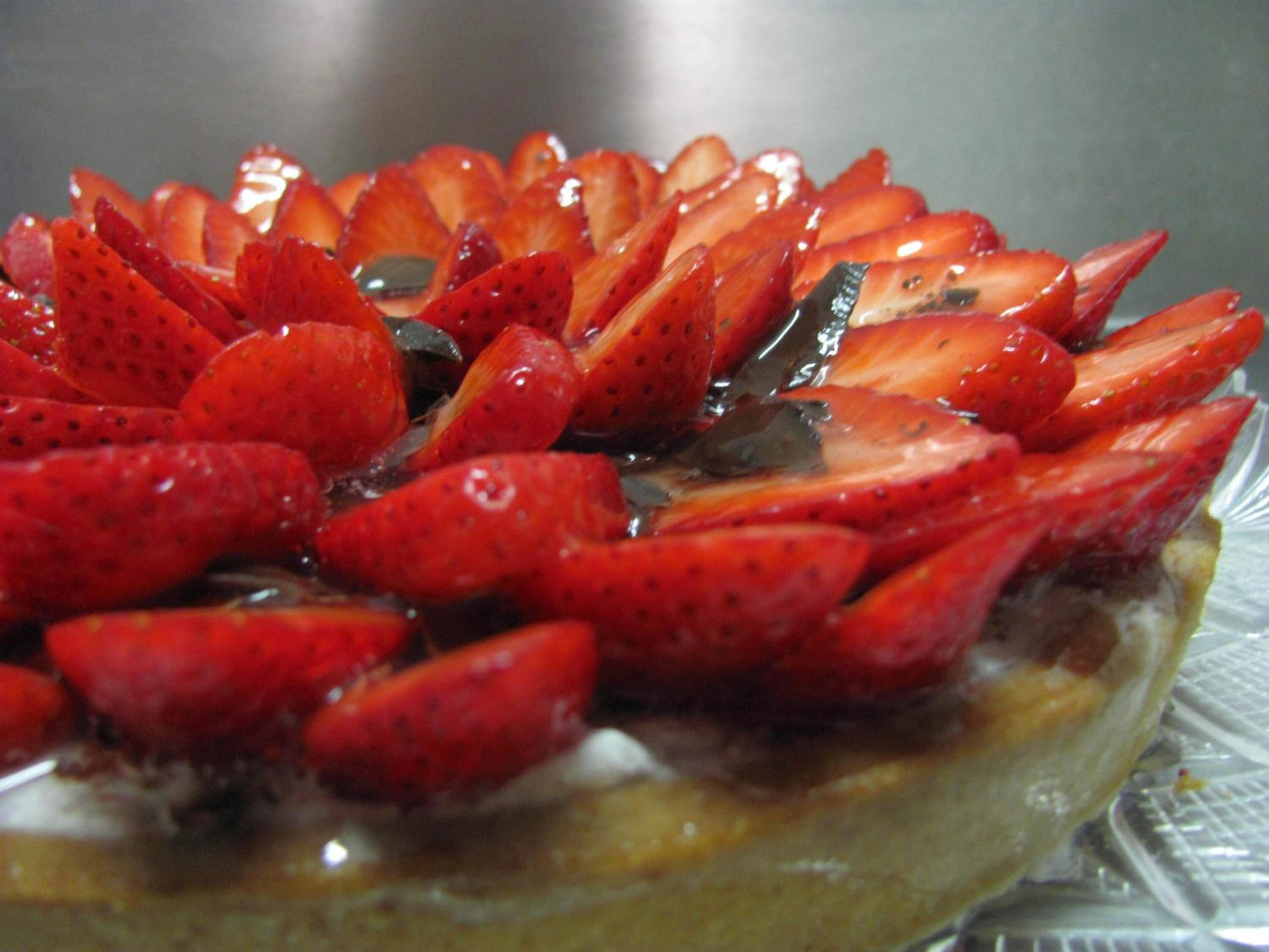 A dessert with sliced strawberries on top.