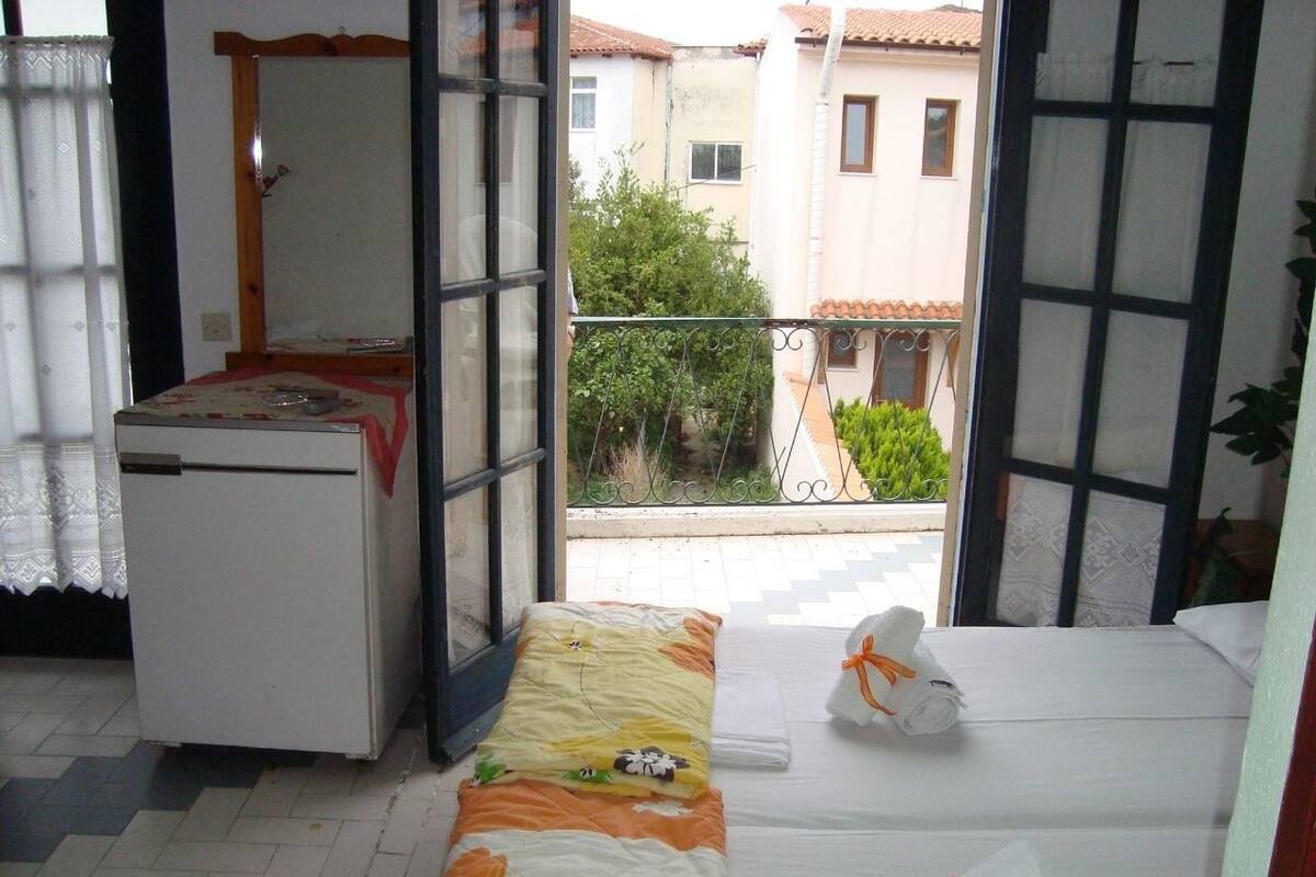 Triple Room | Iron/ironing board (on request), bed sheets