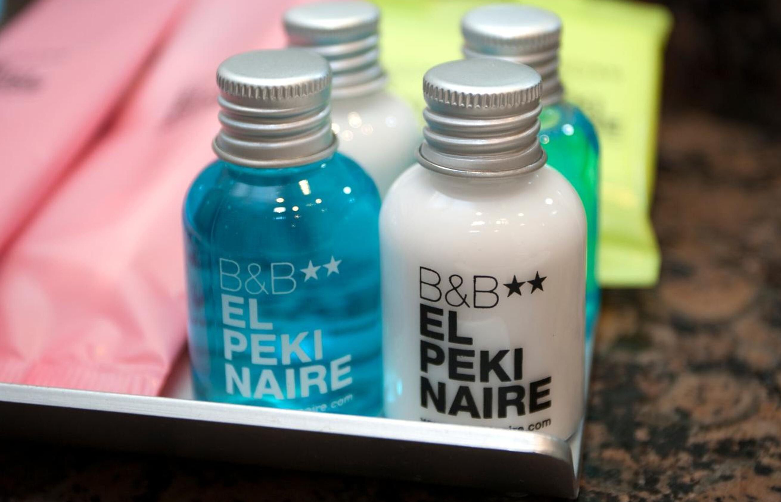 Three bottles of B&B El Peki Naira on a tray.
