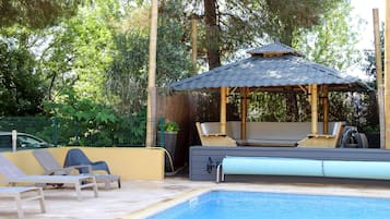 Seasonal outdoor pool, open 10 AM to 8 PM, pool umbrellas, pool loungers
