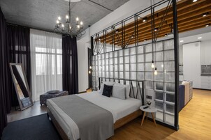 Exclusive Loft, 1 Bedroom, Terrace, City View | Hypo-allergenic bedding, in-room safe, individually decorated