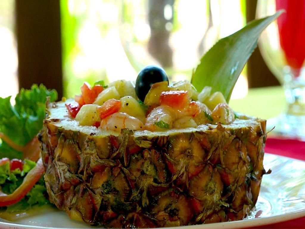 A dish with seafood and vegetables on a plate.
