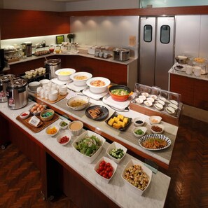 A buffet setup with various food items and condiments. - Hotel Garden Square Shizuoka (Shizuoka)