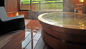A wooden deck with a hot tub, a bench, and a view of greenery. - Shikinosato Kikuya (Sekikawa)