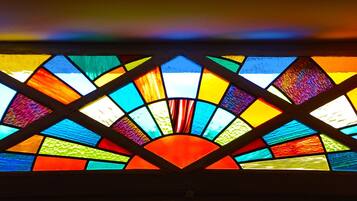 A stained glass window with a geometric design.