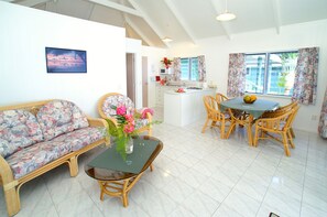 Comfort Bungalow, 1 Bedroom, Garden Area | Living room | Flat-screen TV, DVD player - Sunhaven Beach Bungalows (Rarotonga)
