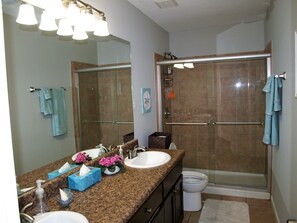 Combined shower/bathtub, hair dryer, towels, soap