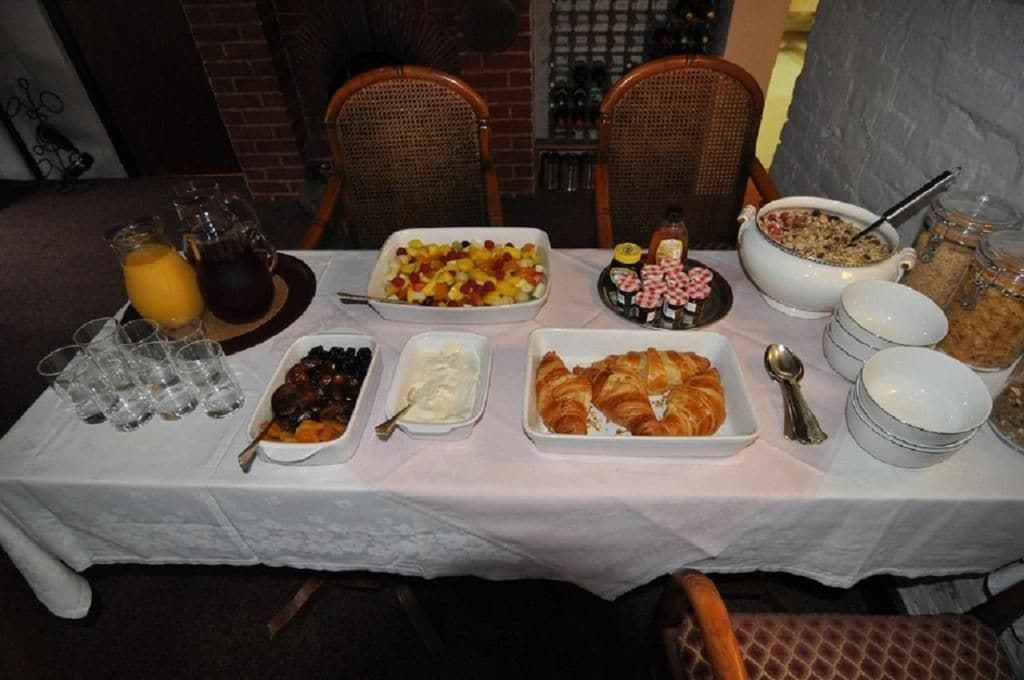 A breakfast buffet with various food items and beverages.
