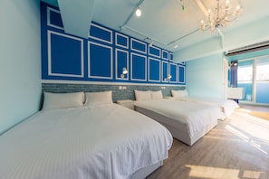 A hotel room with two beds, a brick accent wall, and a large window. - I Hi Hotel (Kaohsiung)
