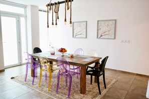 Enjoy meals in this dining area with a wooden table and six comfortable chairs.