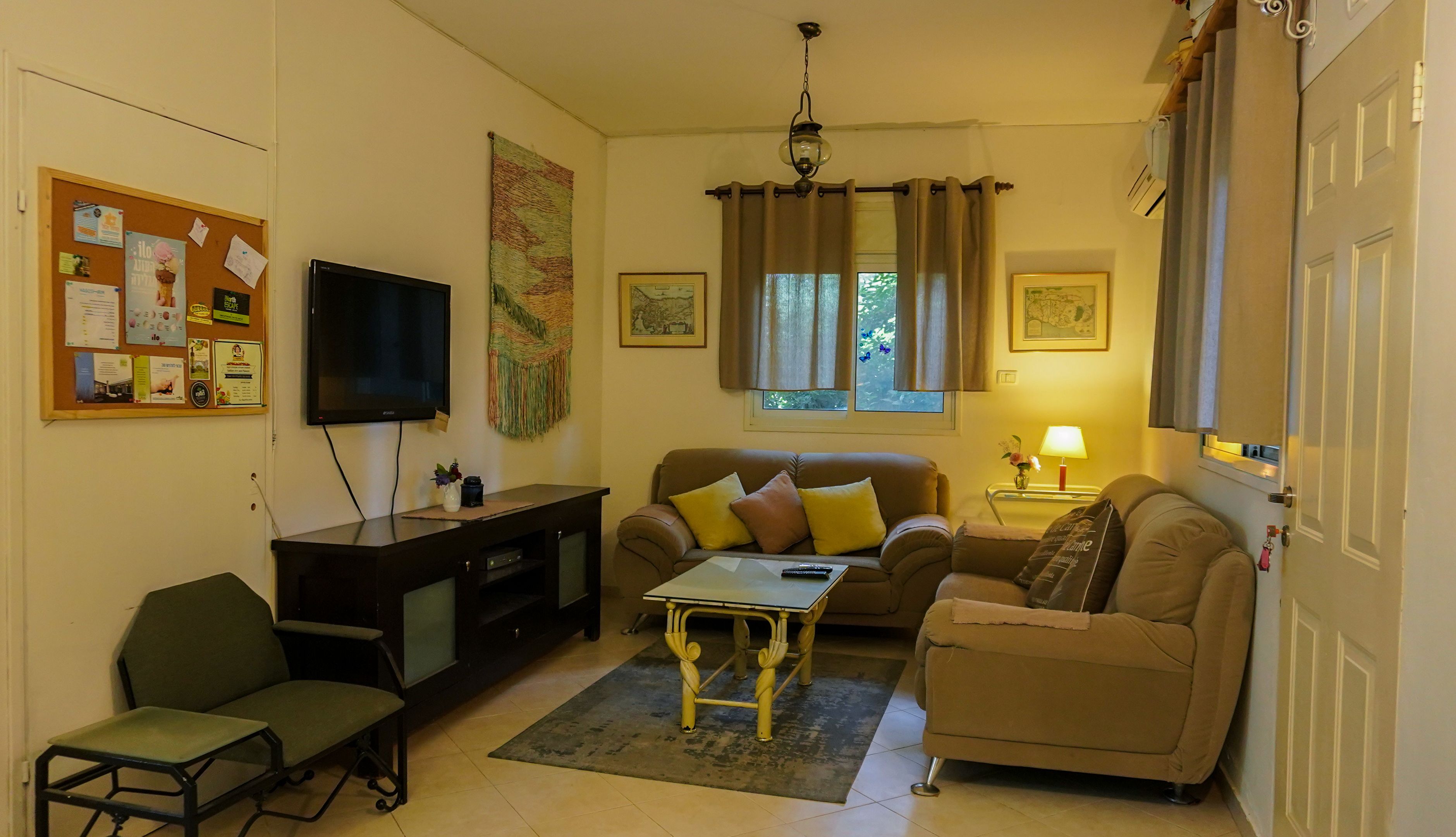 Family Apartment, 2 Bedrooms | Living area | 32-inch flat-screen TV with cable channels, TV