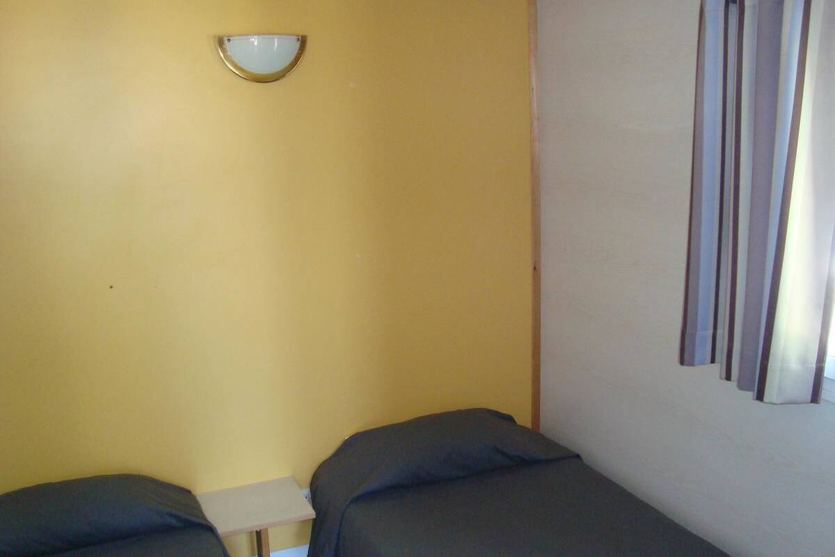 Desk, blackout drapes, individually furnished, bed sheets