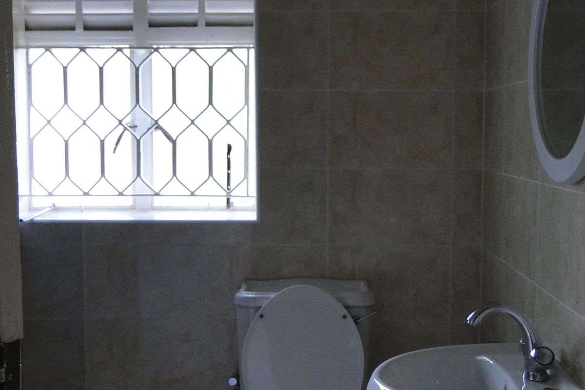 deep-soaking bathtub, rainfall showerhead, free toiletries, slippers