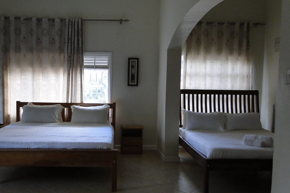 Family Room | Premium bedding, down comforters, in-room safe, desk