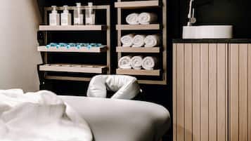 Enjoy a comfortable bathroom experience with a sink, ample storage and a cushioned bench.