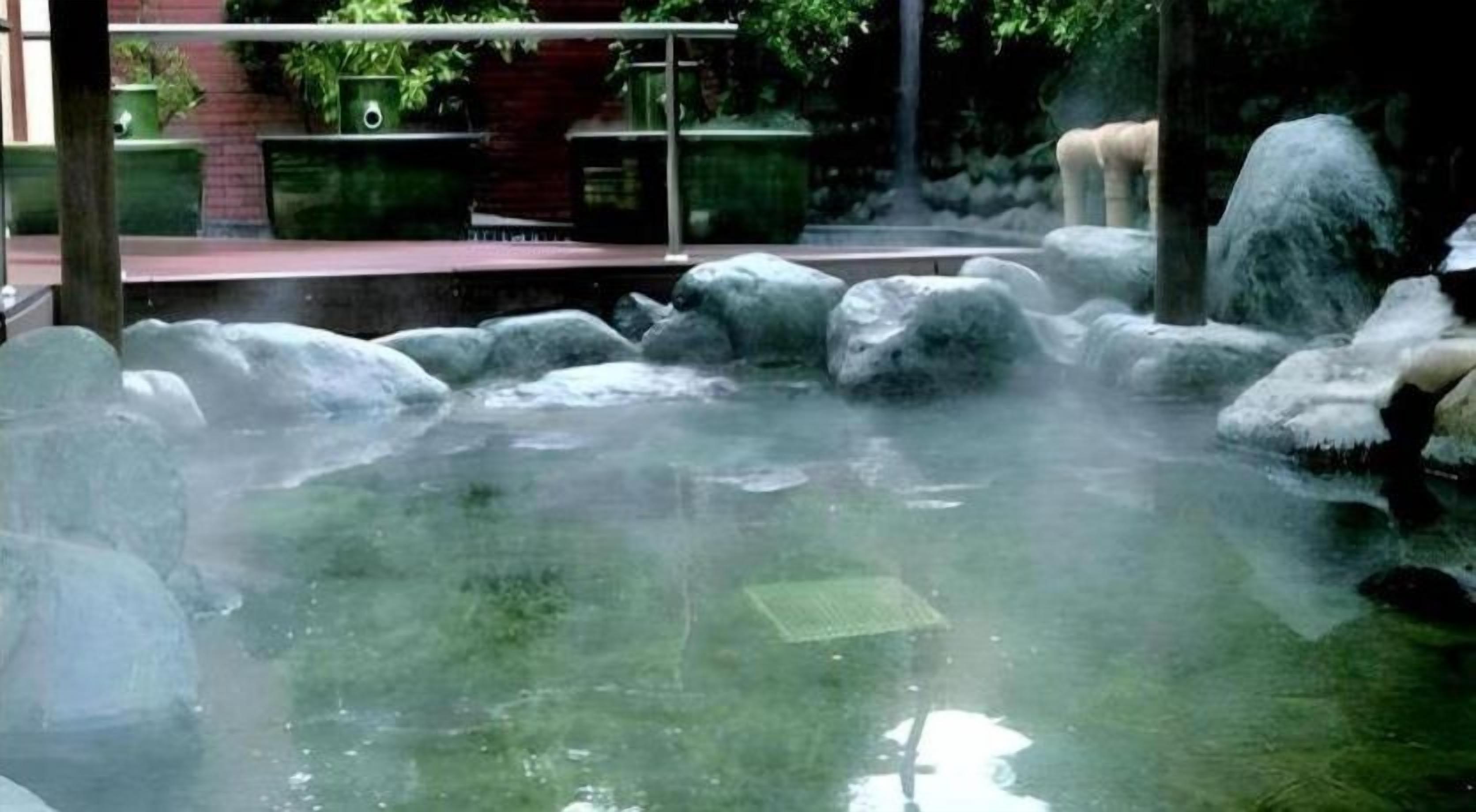 A hot spring area with rocks and water.