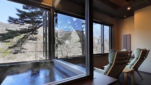 A room with large windows, a wooden bench, and two chairs with cushions. - Seijaku to Magokoro no Yado Nanaeyae (Nikko)