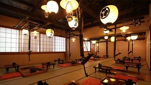 A traditional Japanese room with tatami mats, low tables, and hanging paper lanterns. - Yunishigawa Hakuun-no-yado Yamashiroya (Nikko)
