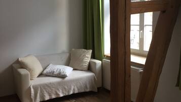 City Duplex, 1 Queen Bed, Private Bathroom, Ground Floor | Living area | Flat-screen TV