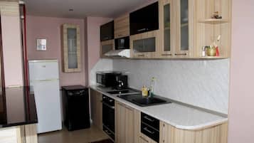Apartment | Private kitchen | Full-size fridge, microwave, oven, stovetop