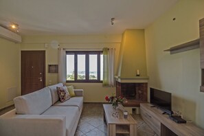 Panoramic Duplex, Sea View, Sea Facing (Nireus) | Living room | 50-inch Smart TV with satellite channels, Netflix, streaming services