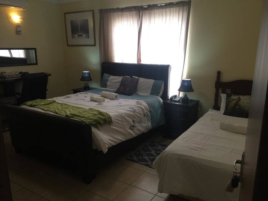 FamilieTwin kamer | Een minibar, een kluis op de kamer, verduisterende gordijnen